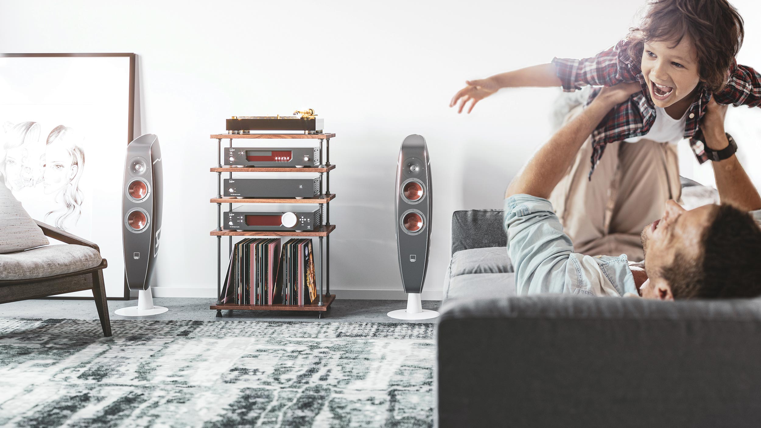Father playing with son in living room near high-end stereo system and vinyl collection